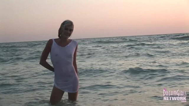 Wet T-shirt Model Rolls around in the Water at Sunset - 1