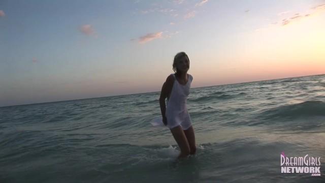 Wet T-shirt Model Rolls around in the Water at Sunset - 2