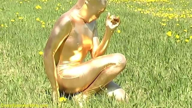 Female Orgasm Ebony Babe in Skintight Golden Spandex Catsuit Posing Outdoor Deep