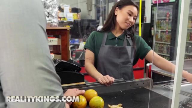 Reality Kings - JMac Fucks Petite Kimmy Kimm behind the Supermarket Counter as she keeps Working - 2