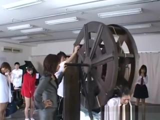 Model japanese schoolgirls punished on waterwheel Tall