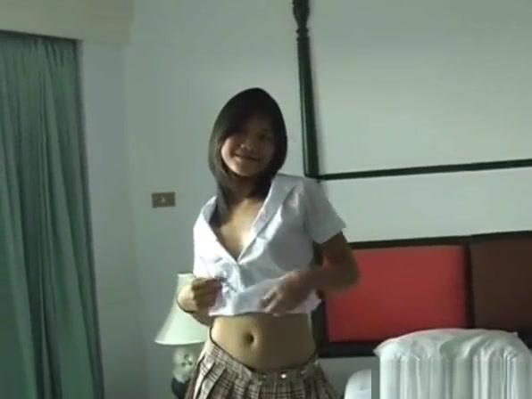 Cute Asian teen strips to reveal her perky little titties - 1