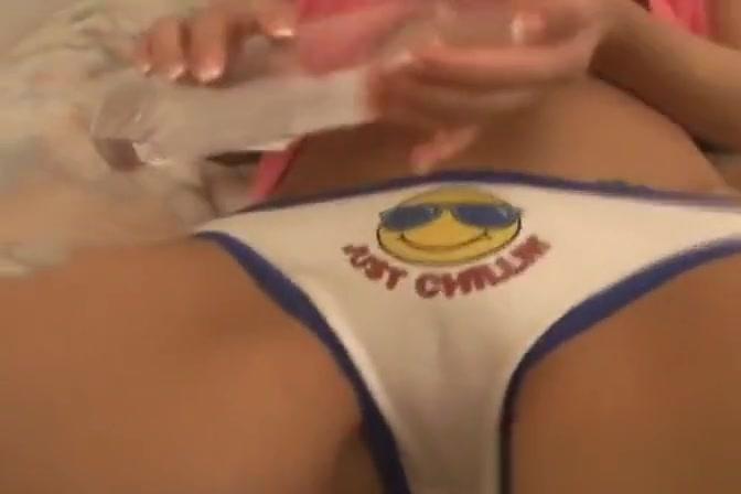 Cute Asian teen pours oil on her panties - 1