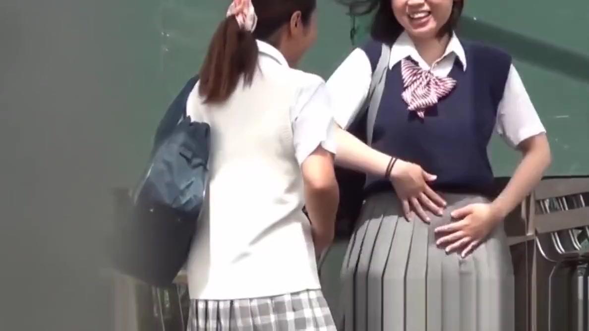 Naughty Japanese schoolgirls pissing in secret public place - 2