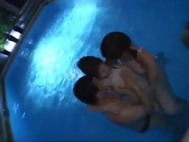 2 japanes girls in white swimsuits play in pool with guy - 2