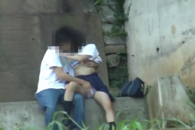 TubeWolf Asian sweetie and her guy having sex on the steps outside Publico