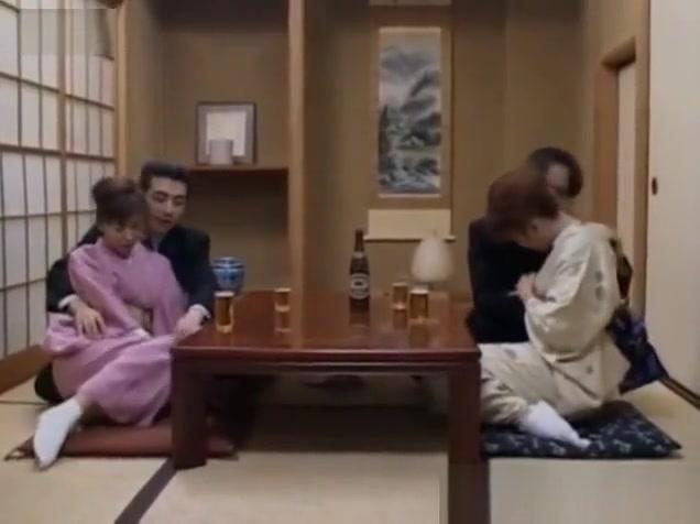 Japanese milfs sticks cock in her cunt next to other couple - 2